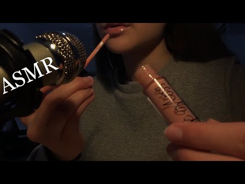 ASMR lipgloss application and popping