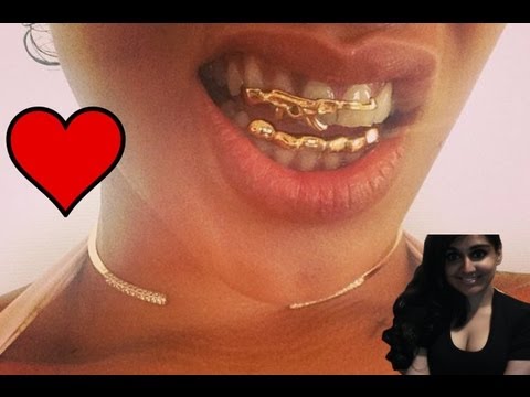Rihanna Takes Violence To A New Level With Gold Gun Grill - my thoughts