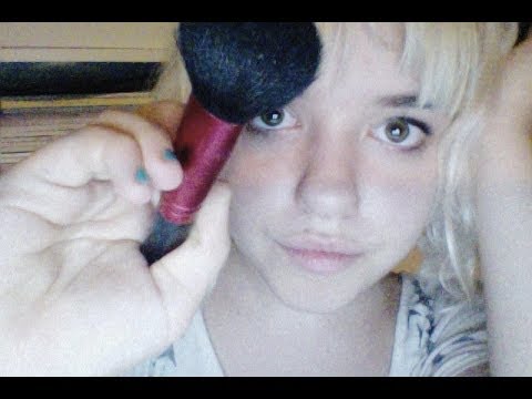 Brushing your face for tingles and whispering ASMR