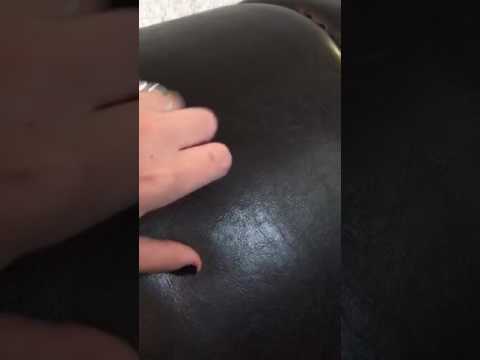 ASMR up close quick tapping and scratching on a leather couch