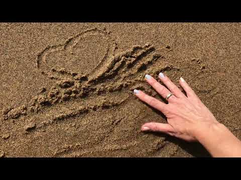 ASMR drawing images in sand with hand waves sounds water beach shore relaxing