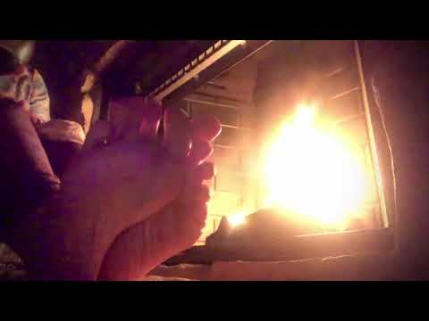ASMR warming bare feet by fire