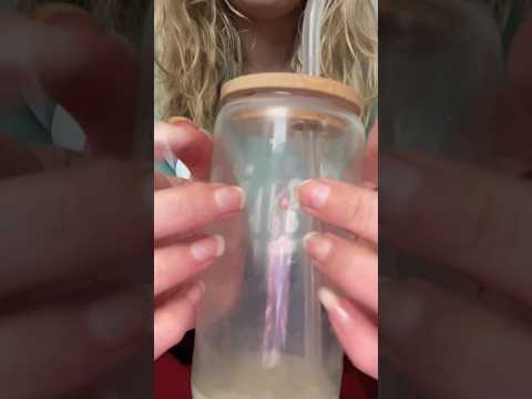 Tapping on a glass cup with wooden lid