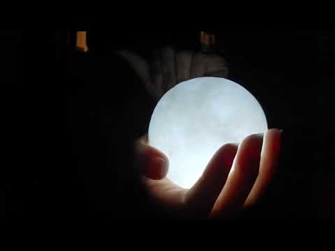 gripping and tapping sounds on moon lamp