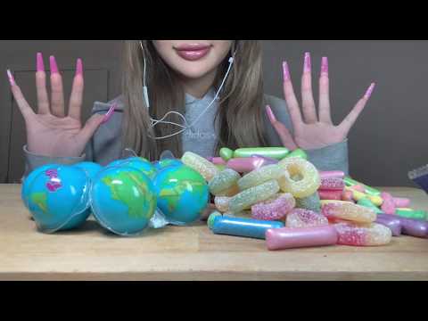 asmr eating planet gummies and assorted candies