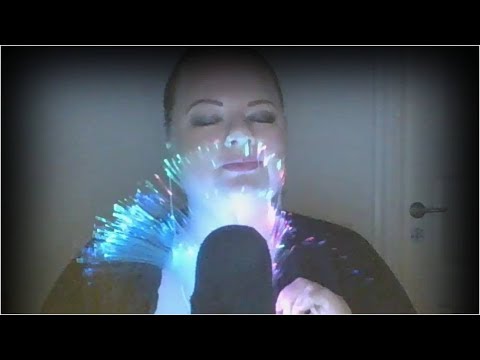 ASMR close up whispering ear to ear with some gentle mic scratching + visuals from a lamp
