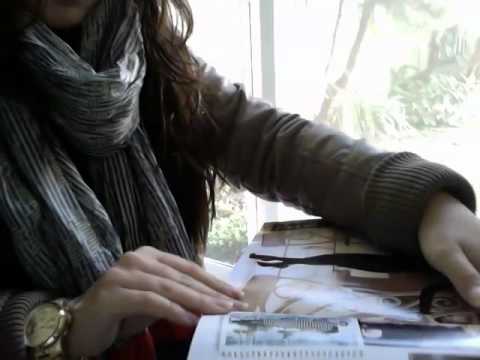 ASMR turning pages of a magazine, whispering in spanish