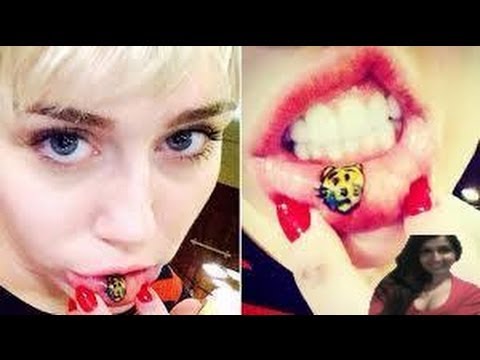 Miley Cyrus News 2014 :Miley Cyrus Gets "Sad Kitty" Tattoo On Inner Lip -- video review