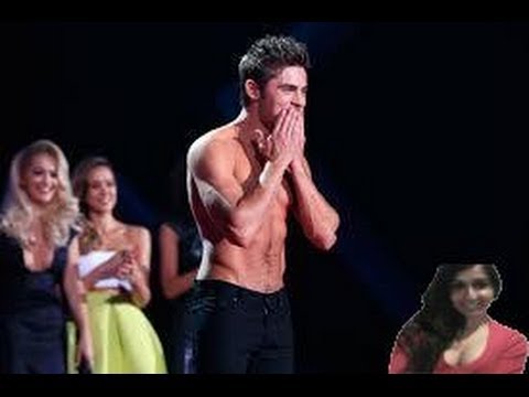 Zac Efron Strips Down At The 2014 MTV Movie Awards Show Stage - Video Review