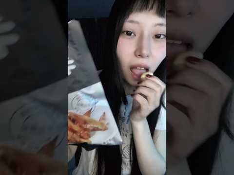 Eating asian snacks not spicy chips with chicken nyam