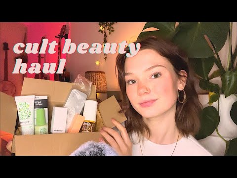 ASMR cult beauty haul (whispers, tapping, lid sounds)