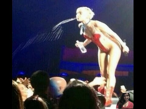 Miley spitting water on fans during concert live performance show - video review